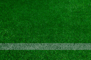 Green Grass Soccer Field Background by SlidesCorner