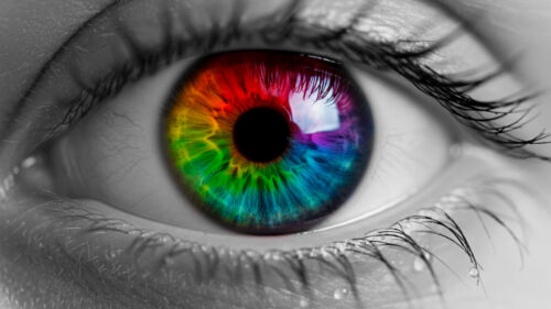 human eye with multicolor iris, like rainbow colors