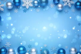 Light blue Christmas background with snowflakes and blue and silver baubles