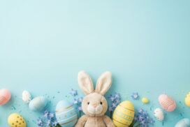 Light Blue Background for PPT with Bunny, Easter Eggs and Flowers