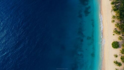 Water Background for Slides with Blue Ocean and Beach – Free HD Presentation Background