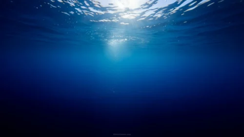 Blue Background With Underwater Sunrays Breaking The Surface Blue Background With Underwater Sunrays Breaking The Surface