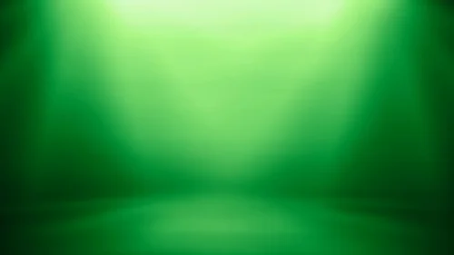 Green Studio Background For PowerPoint With Overhead Spotlight Green Studio Background For PowerPoint With Overhead Spotlight