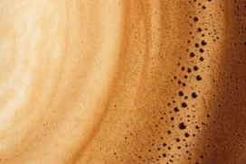 Coffee Crema Foam Texture Background for PowerPoint with Caramel Swirls and Tiny Bubbles
