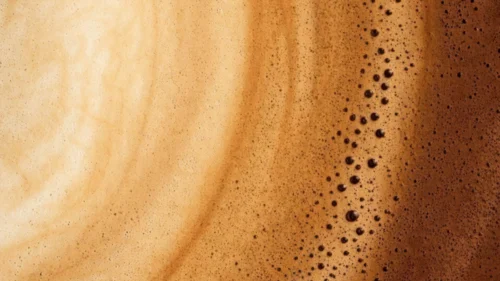 Coffee Crema Foam Texture Background for PowerPoint with Caramel Swirls and Tiny Bubbles Coffee Crema Foam Texture Background for PowerPoint with Caramel Swirls and Tiny Bubbles