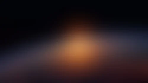 Dark Bokeh Background for Google Slides with a Blurred Amber Glow