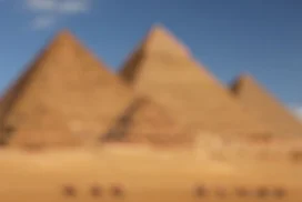 Egypt Background For PowerPoint With Blurred Giza Pyramids Under A Clear Blue Sky
