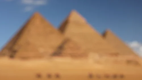 Egypt Background For PowerPoint With Blurred Giza Pyramids Under A Clear Blue Sky Egypt Background For PowerPoint With Blurred Giza Pyramids Under A Clear Blue Sky