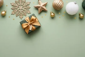 Green Christmas Flat Lay Background for PowerPoint with Gold Gift Bow and Sage Backdrop