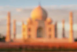 Taj Mahal Background For PowerPoint With A Blurred Marble Dome In Peach Sunset Light