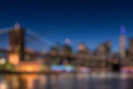 City Skyline Background for PowerPoint with Blurred Bridge Lights at Night