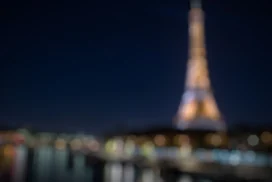 Paris Eiffel Tower Night Background for PowerPoint with Blurred Golden City Lights