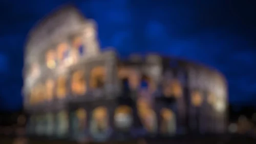 Rome Colosseum Night Background for PowerPoint with Blurred Amber Arches on Deep Blue Sky