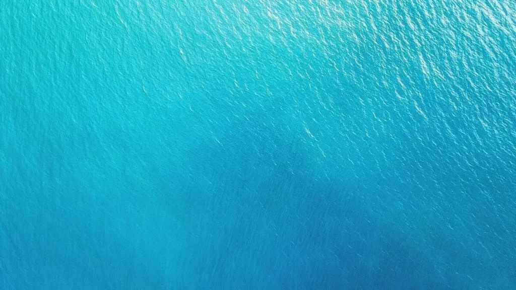 Ocean Water Background For PowerPoint With An Aerial Turquoise View