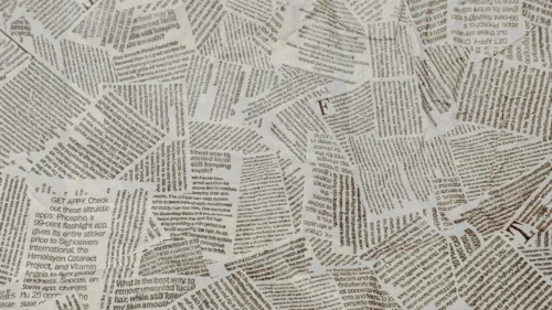 Newspaper Background for PowerPoint with Torn Black Text Scraps on Gray Paper